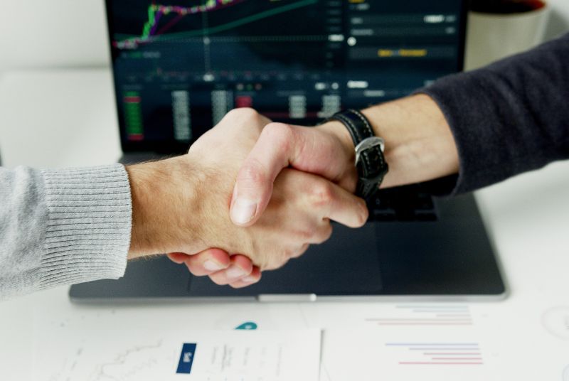 An image of two people shaking hands